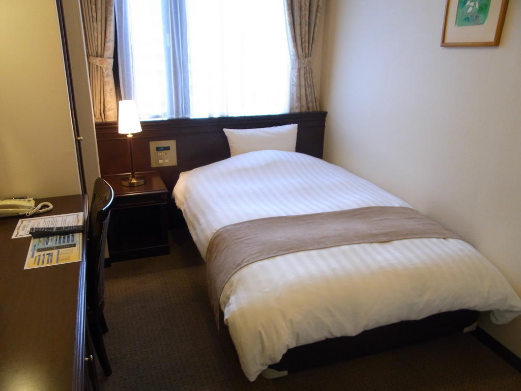 Amami Sunplaza Hotel Chambre photo